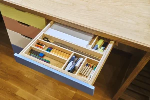 organized desk drawer with divided compartments for practical and easy access
