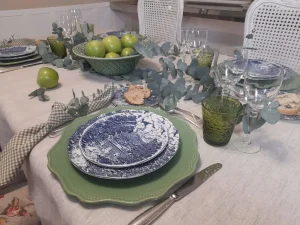 Balanced table composition combining traditional silver flatware with relaxed natural elements
