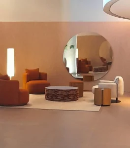Modern lounge featuring a large round mirror that enhances balance and visual space