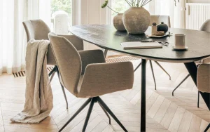 Neutral dining chairs paired with different dining tables, demonstrating long-term versatility